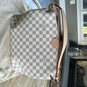Women’s cream Louis Vuitton bag. Never been used.